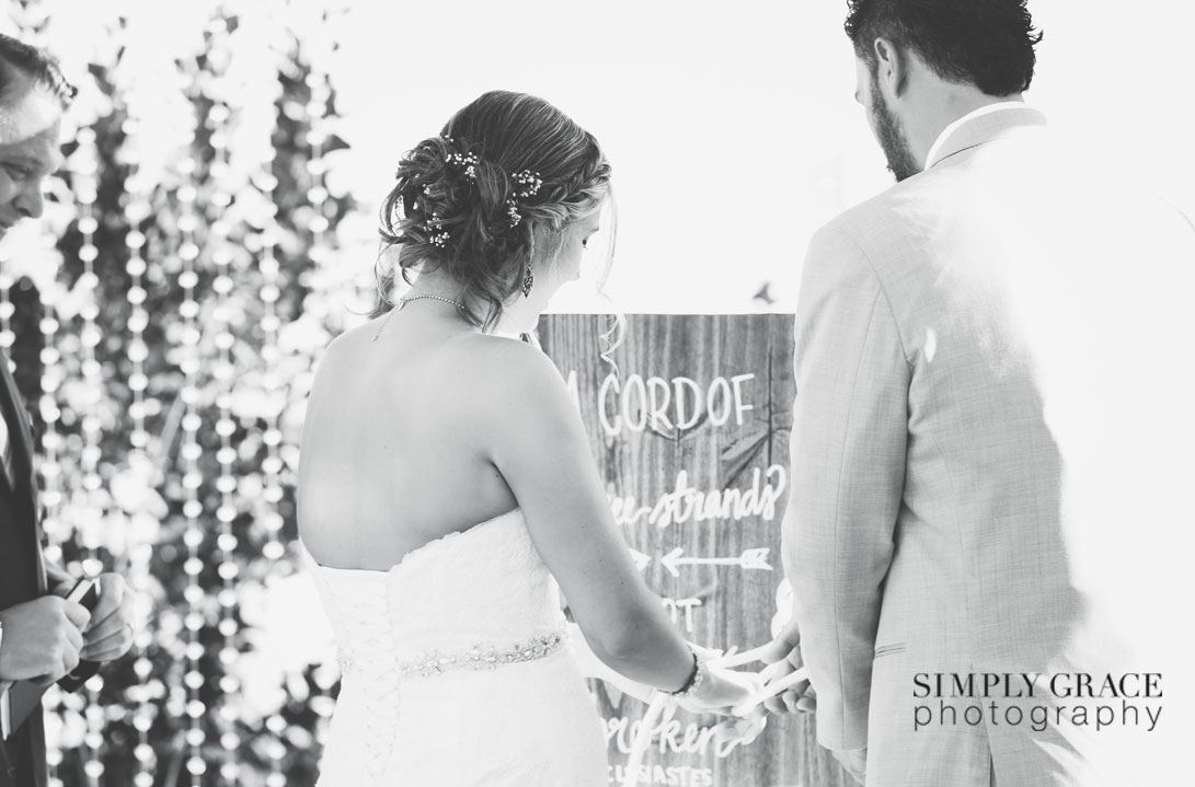 The Rhapsody Wedding cord tieing photo by Simply Grace Photography