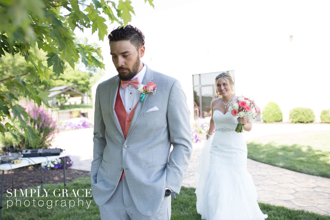 The Rhapsody Wedding first look photo by Simply Grace Photography