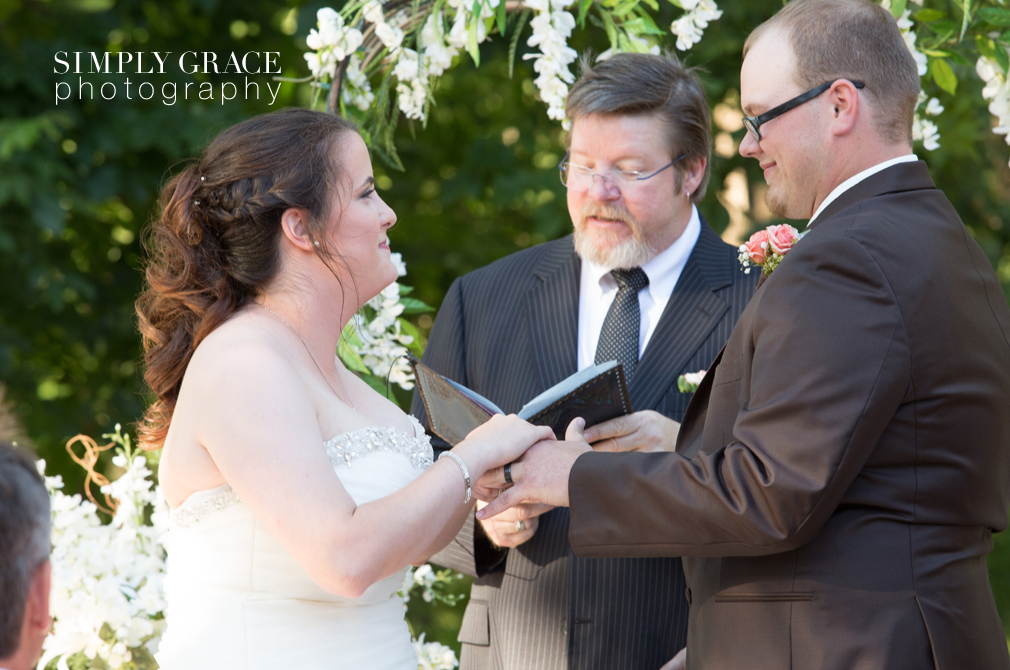 James P Davis Hall wedding ceremony signing photo by Simply Grace Photography