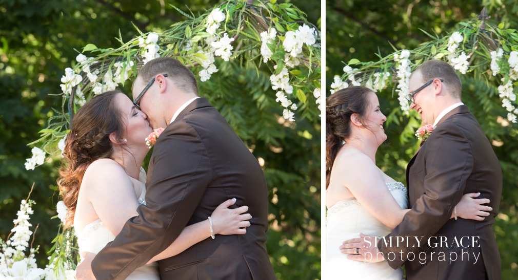 James P Davis Hall wedding ceremony kiss signing photo by Simply Grace Photography