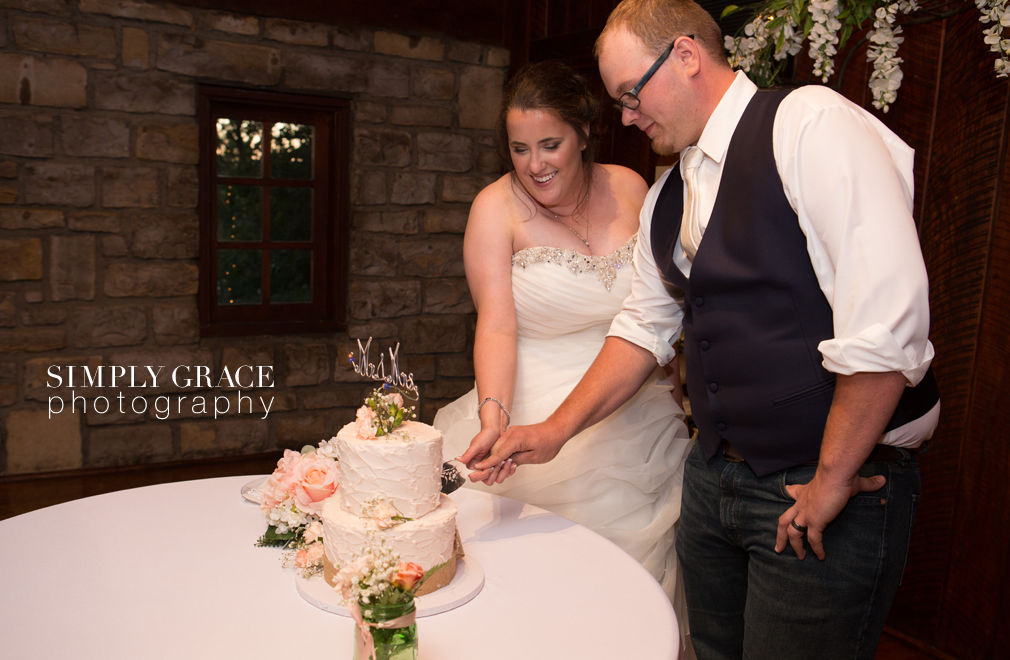 James P davis hall wedding Cake cutting photo by Simply Grace Photography