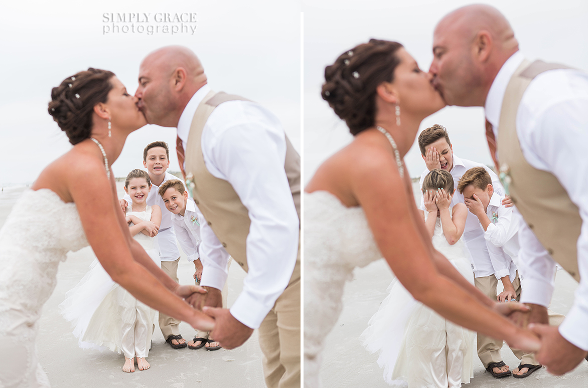 bride and groom kissing with kids reaction amelia island wedding beach simply grace photography