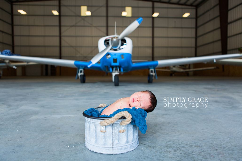 newborn in airplane hanger savannah simply grace photography