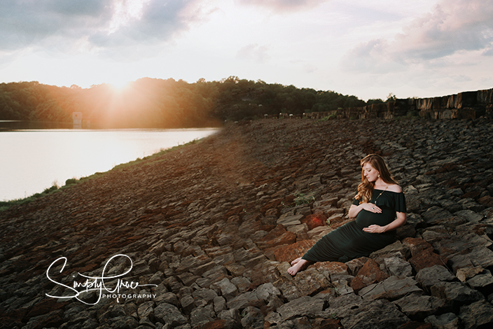 wyandotte county lake maternity session sunset green dress on damn