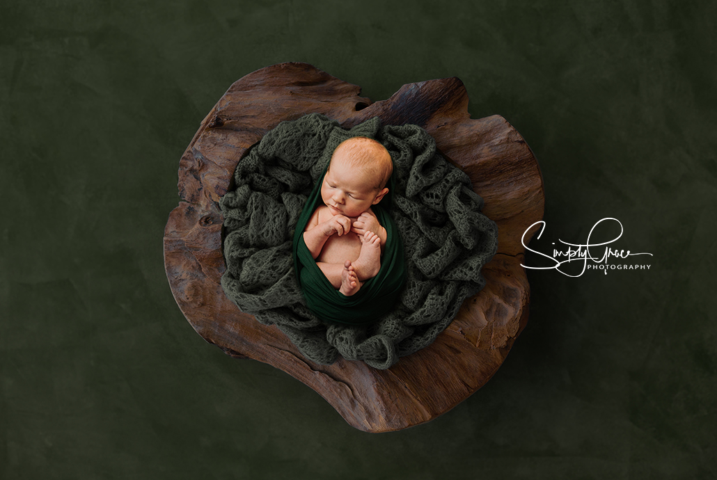 newborn boy green composite in wood bowl