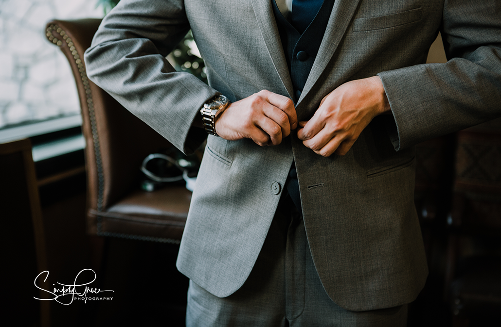 lake tahoe wedding kansas city wedding photographer groom prep buttoning jacket