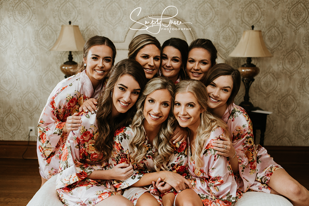 eighteen ninety bridesmaids on bed simply grace photography