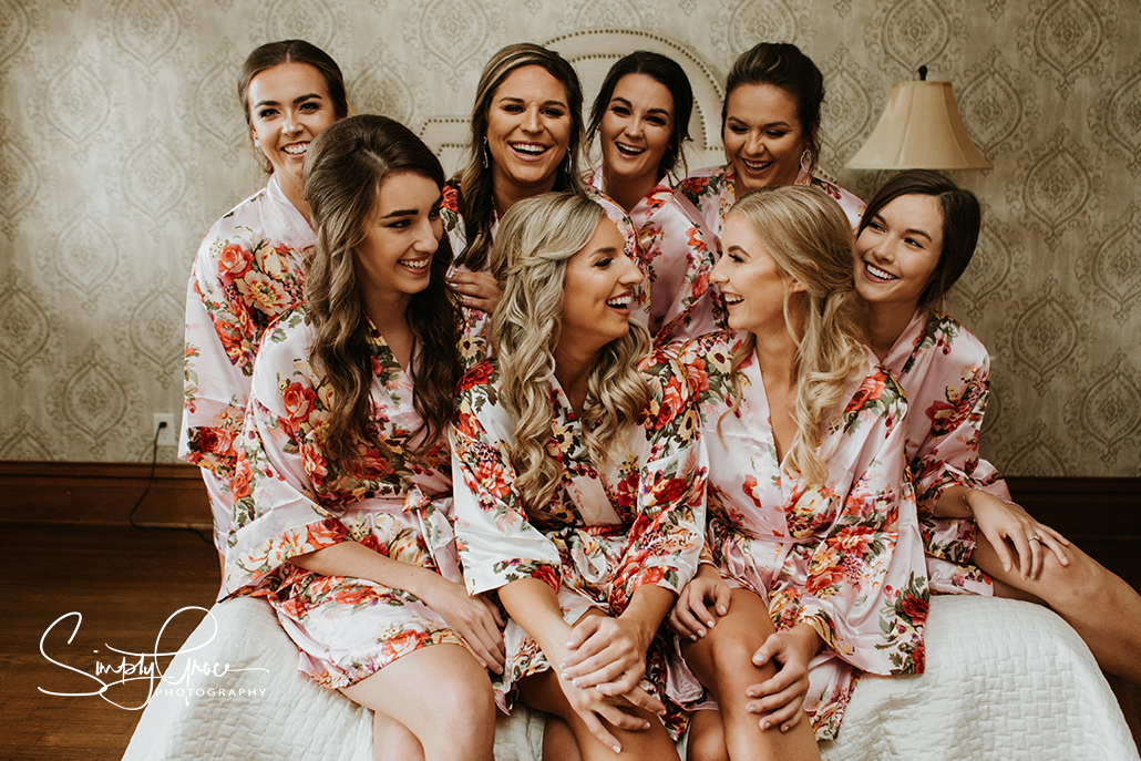 eighteen ninety wedding bridesmaids on bed simply grace photography
