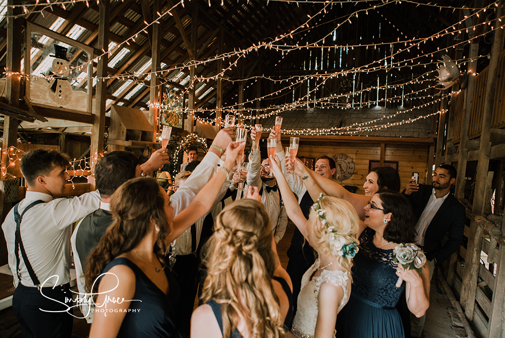 paradise park wedding simply grace photography bridal party toasts in barn