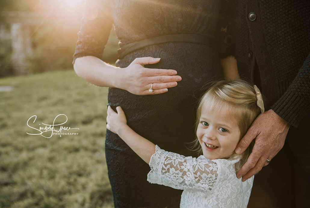 Loose park maternity with daughter hugging belly simply grace photography