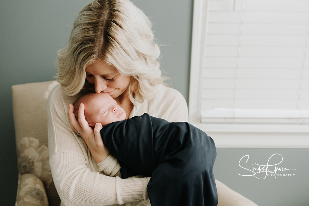 mom alone snuggling with baby in a newborn session simply grace photography