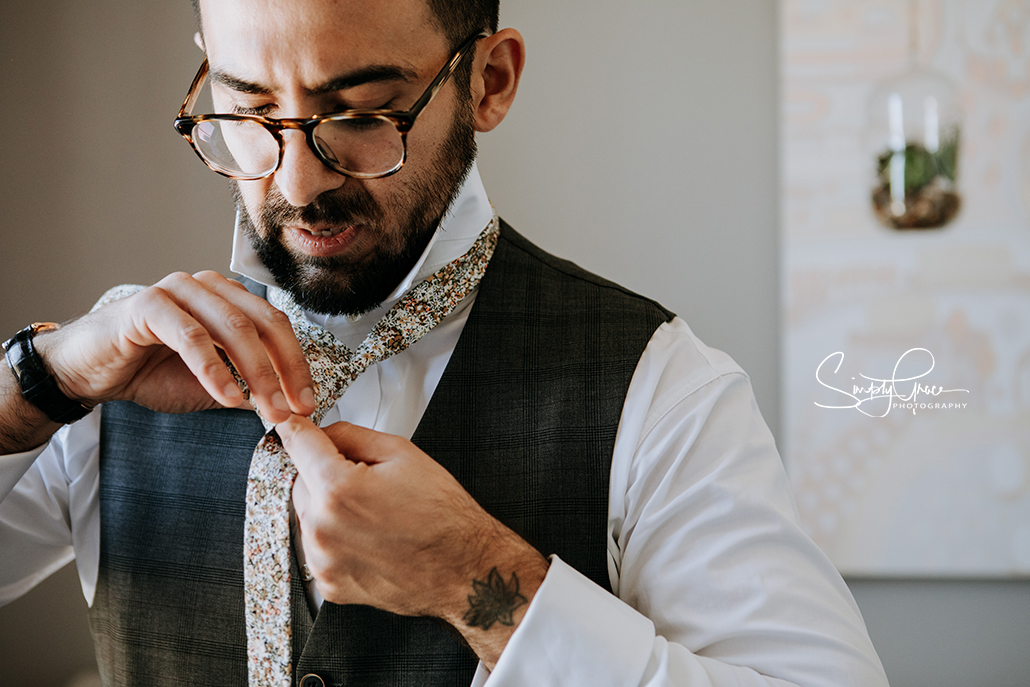 groom getting ready at two tides brewry