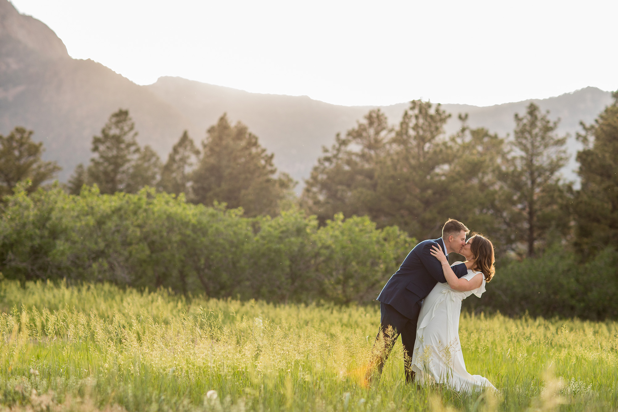 long dip kiss at air force academy engagement session by simply grace photography
