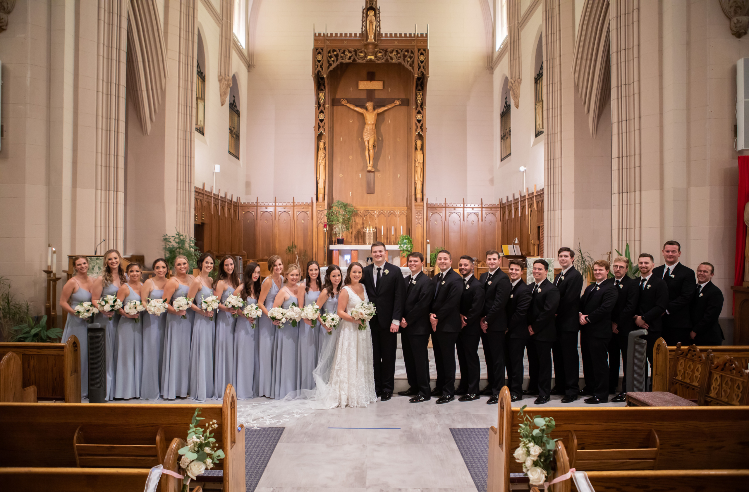 full bridal party at st dominic chapel in denver colorado