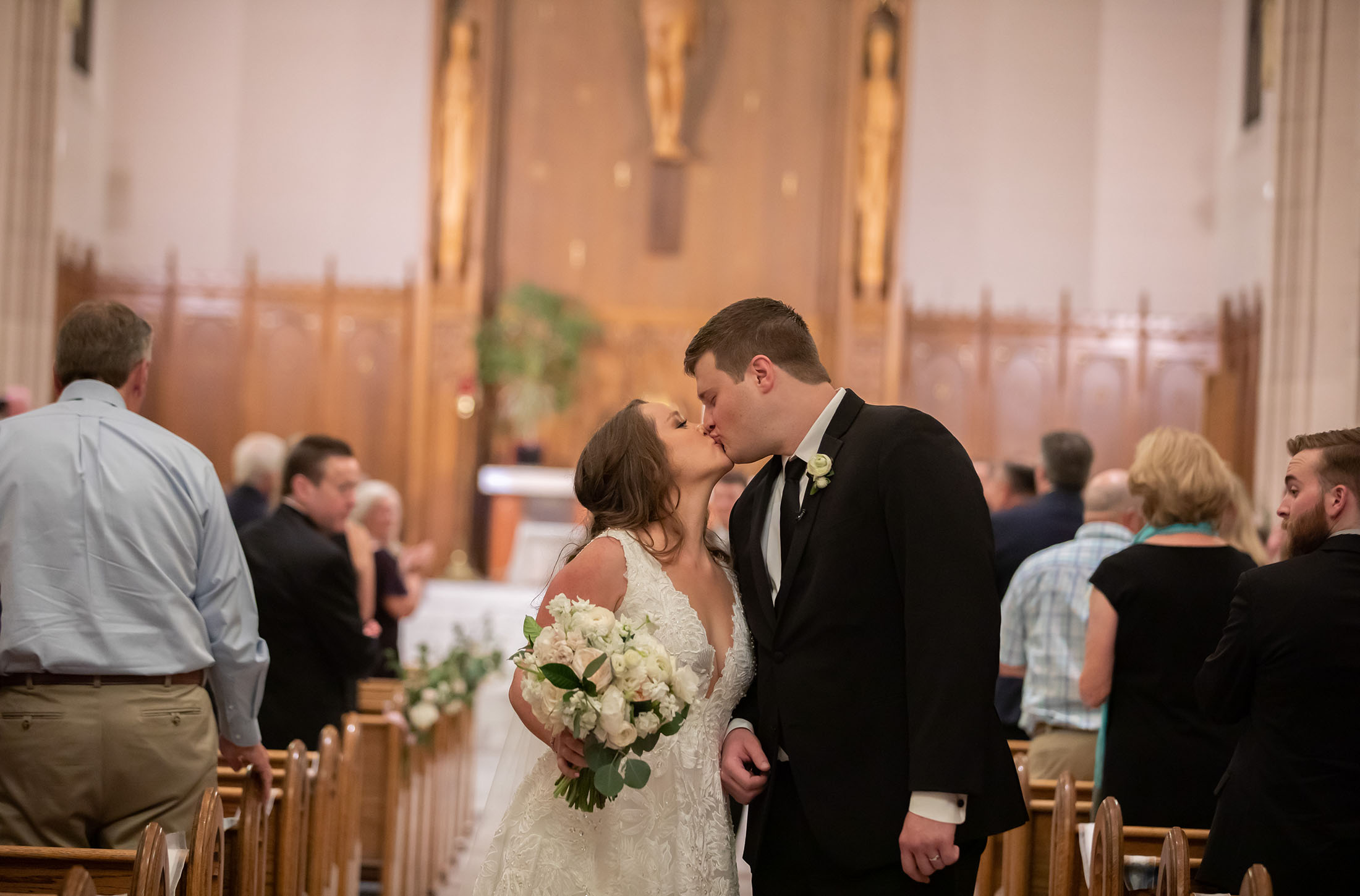 bride and groom kissing after getting married