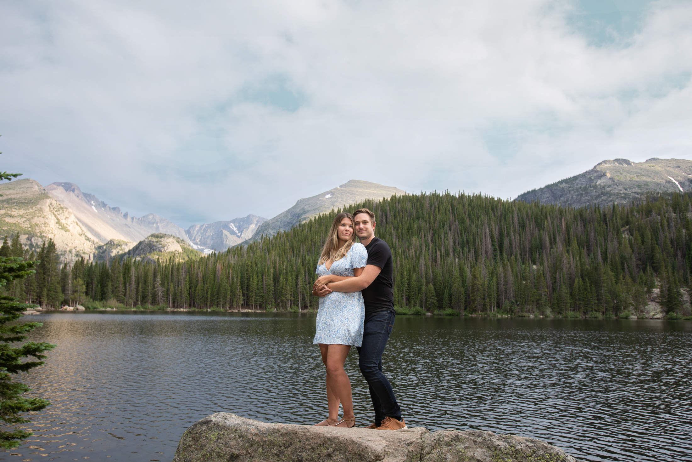 couple posing on rock at bear lake rocky mountain national park