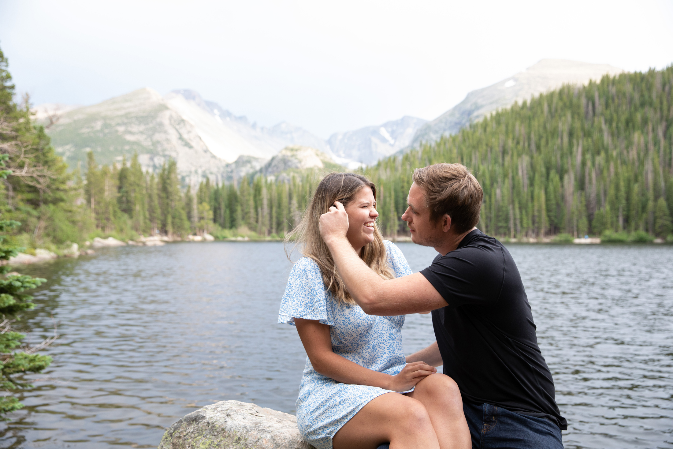 fiance removes hair from face at bear lake