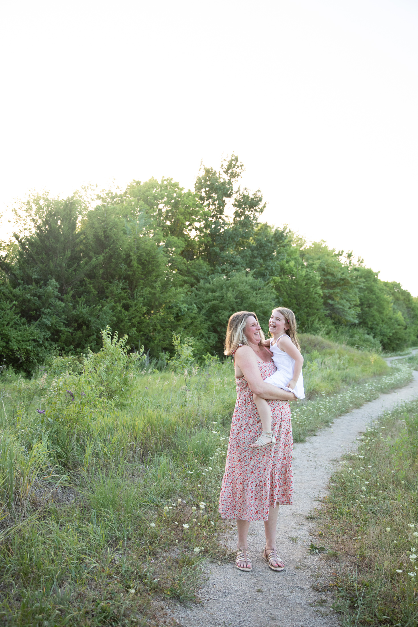 mom holds daughter during maternity session at jerry smith park
