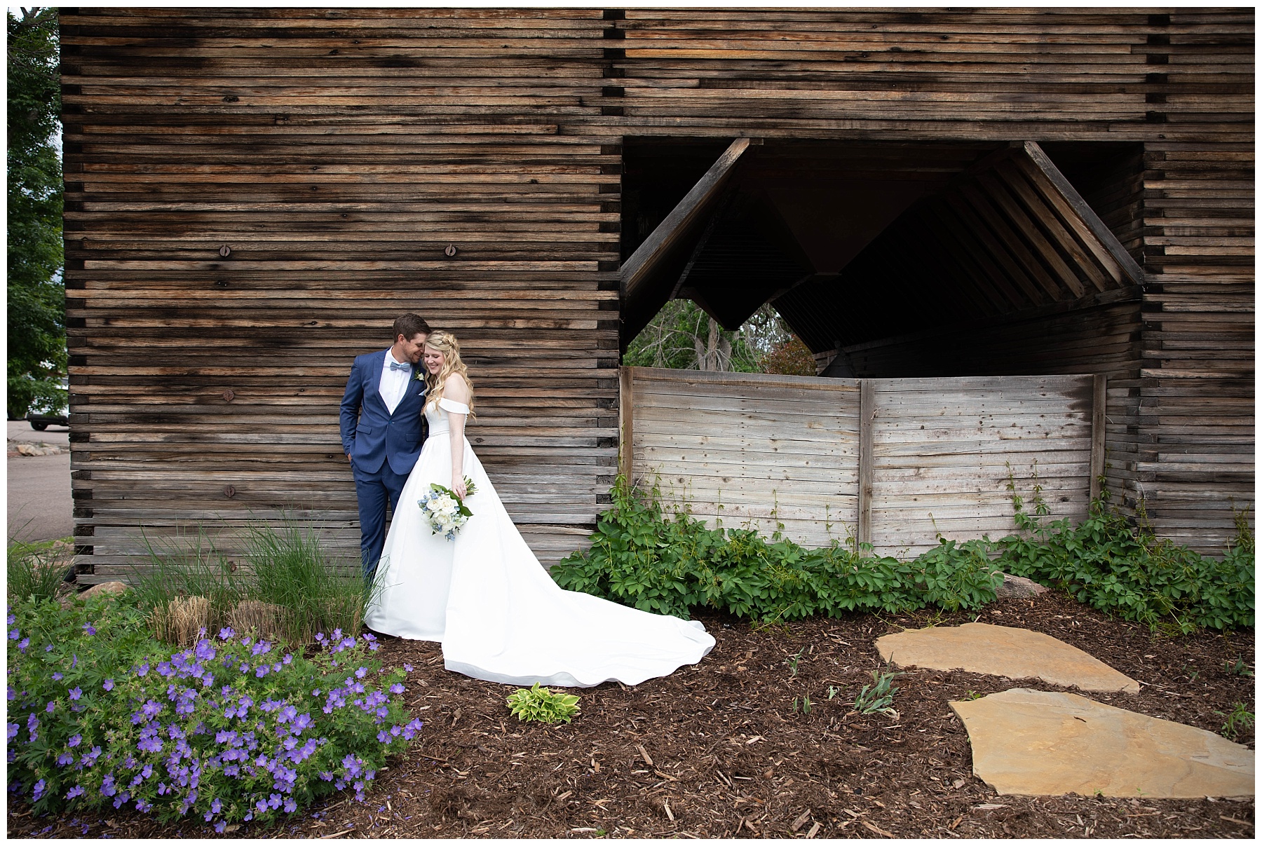 bride and groom cuddle for photos with simply grace photography