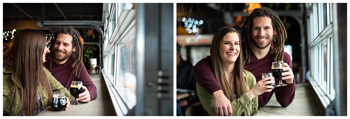 couple posed by the window at red leg brewery