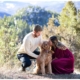 mount falcon engagement session kissing puppy dog