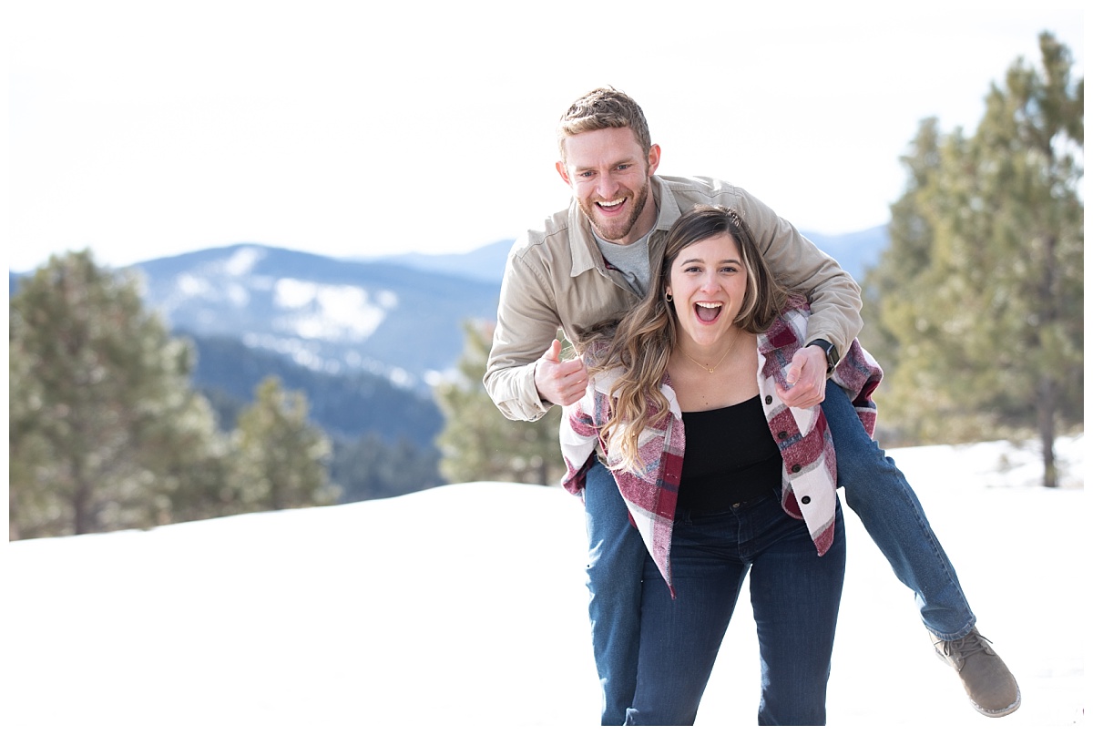 mount falcon engagement session girl gives guy a piggyback ride