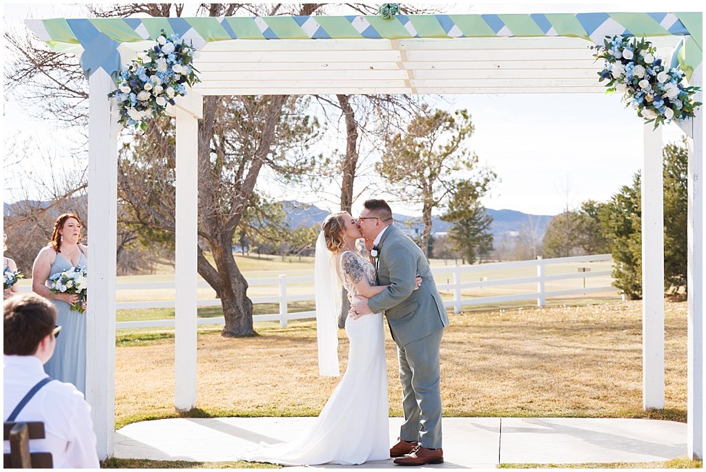 ceremony kiss at the barn of raccoon creek simply grace photography